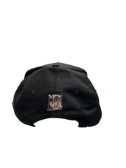 Back view of black JG Double Gallo snapback hat with metallic rear logo emblem