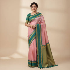 Green and gold saree with a pink blouse on a white background