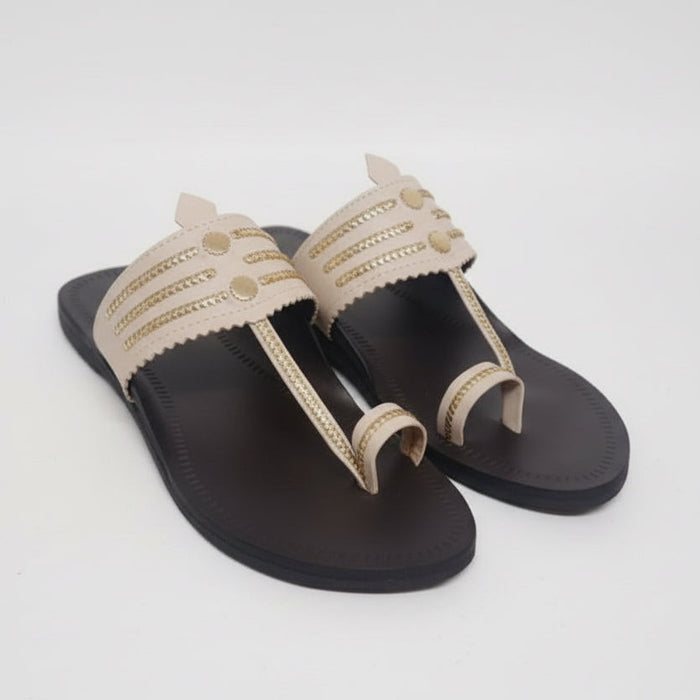 The Mina Cream Kolhapuri chappal for women, handcrafted rosy-gold leather sandal with crossover design by NIIRA