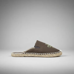 Brown espadrille shoe with jute sole on a white background