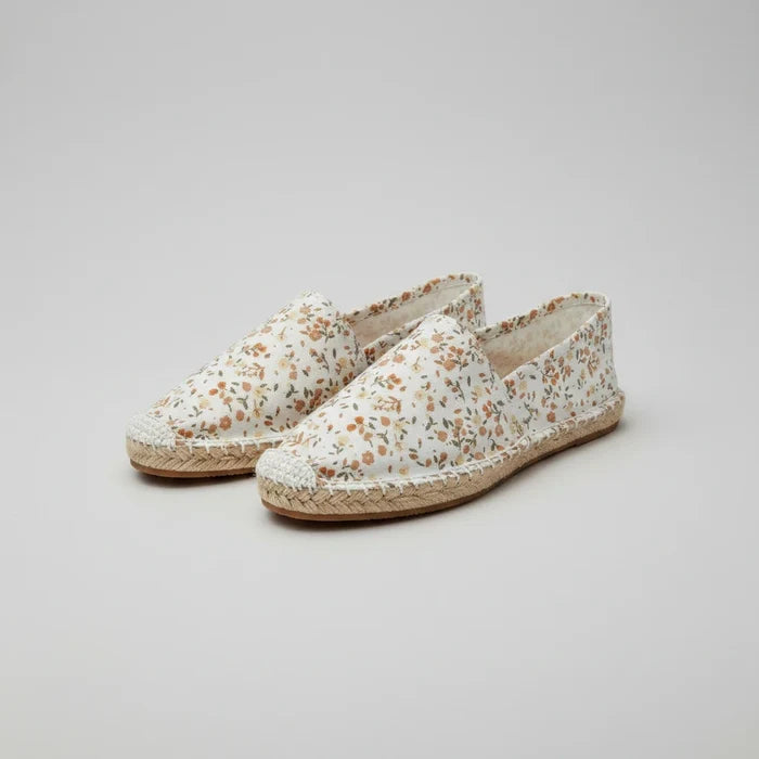 Floral patterned slipper on a white background