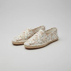 Floral patterned slipper on a white background