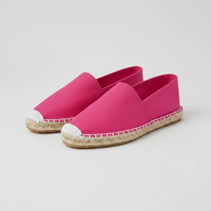 Pink espadrille shoe on a white background
