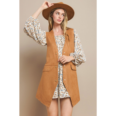 tan suede long western vest with button front and flap pockets