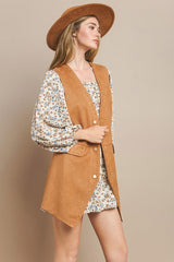 tan suede long western vest with button front and flap pockets
