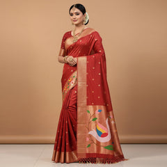 Red fabric with colorful bird and floral patterns on a white background