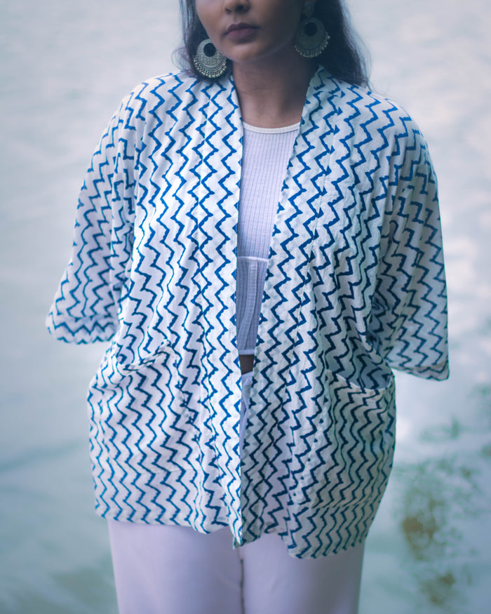 Raahi Shrug in white and blue hand block print, unisex handcrafted cotton shrug by NIIRA