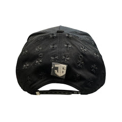 Back view of black JG clover snapback hat with adjustable snapback closure and metallic logo emblem